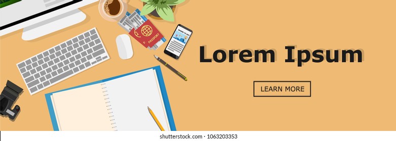 Banner for website- top view of desk with keyboard, computer, empty note book, passport with economy plane tickets, coffee, mobile phone, camera, mouse and copy space for text