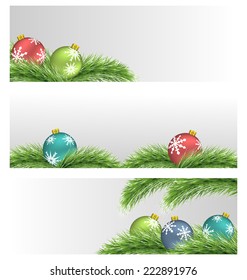 Banners with multicolored Christmas balls on pine branches