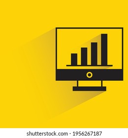 bar chart on desktop computer with shadow on yellow background