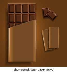 A bar of chocolate in a torn golden package and a few chocolate pieces on a golden background