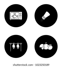 Barbecue glyph icons set. BBQ. Grilled fish in microwave, salt or pepper shaker, vegetables, stockfish. Vector white silhouettes illustrations in black circles