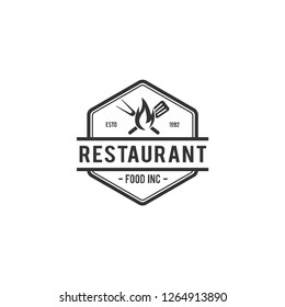 Barbecue restaurant - vintage logo concept. Logo of Barbecue, Grill and Bar with fire, grill fork and spatula. BBQ logo template. Badge. Vector illustration
