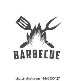 Barbecue vintage logo. Logo of Grill and Bar with fire, grill fork and spatula. BBQ logo template. Grunge texture