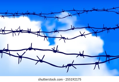 Barbed wire against the sky