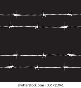 Barbed wire fence on a black background