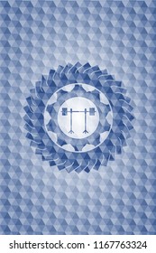 barbell on rack icon inside blue emblem or badge with abstract geometric pattern background.