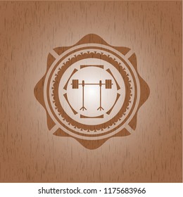 barbell on rack icon inside wooden emblem. Retro