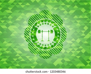 barbell on rack icon inside realistic green emblem. Mosaic background