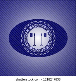barbell on rack icon inside emblem with denim high quality background