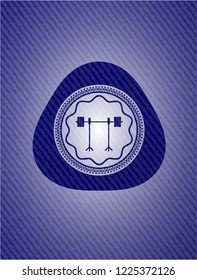 barbell on rack icon inside badge with jean texture