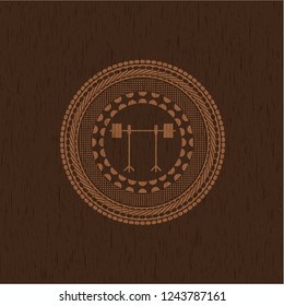 barbell on rack icon inside wood emblem