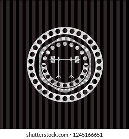 barbell on rack icon inside silver badge