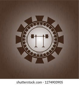 barbell on rack icon inside retro wooden emblem