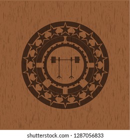 barbell on rack icon inside wood badge or emblem