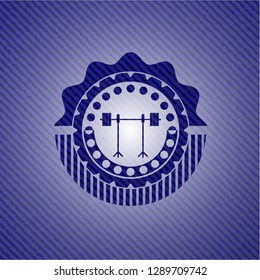 barbell on rack icon inside jean or denim emblem or badge background