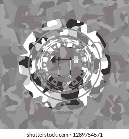 barbell on rack icon inside grey camo emblem