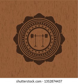 barbell on rack icon inside wooden emblem. Retro