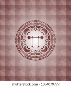 barbell on rack icon inside red seamless emblem or badge with geometric pattern background.