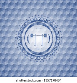 barbell on rack icon inside blue emblem or badge with abstract geometric pattern background.