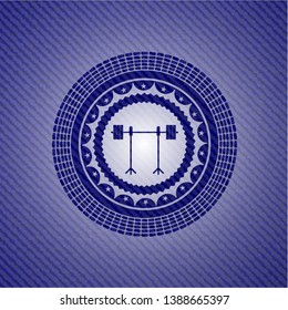 barbell on rack icon inside jean or denim emblem or badge background