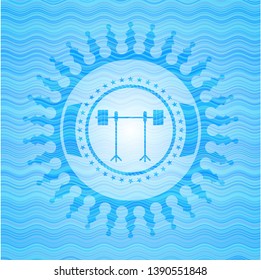 barbell on rack icon inside water emblem.