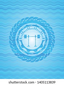 barbell on rack icon inside water representation style emblem.