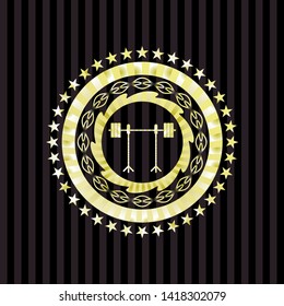 barbell on rack icon inside gold emblem or badge