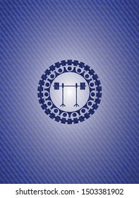 barbell on rack icon inside emblem with denim texture