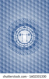 barbell on rack icon inside blue emblem with geometric background.