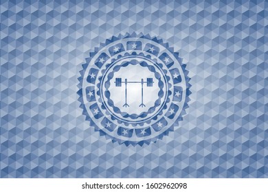 barbell on rack icon inside blue emblem or badge with geometric pattern background.