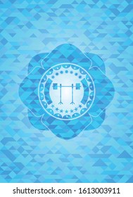 barbell on rack icon inside light blue emblem with mosaic ecological style background