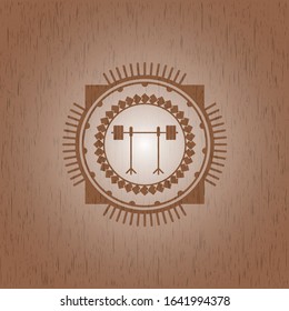 barbell on rack icon inside wooden emblem. Vintage.