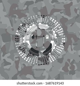 barbell on rack icon inside grey camo emblem