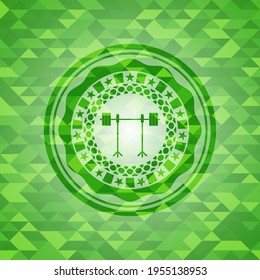 barbell on rack icon inside green emblem with triangle mosaic background. 