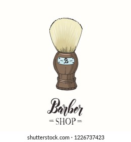 Barber Shop. Hand drawn color shaving brush in sketch style. Hand made lettering. Vector illustration