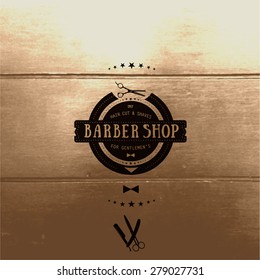 Barber shop logo. Handwritten text "BARBER SHOP". Tree background.