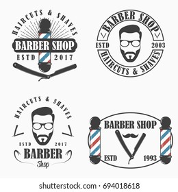 Barber Shop logo set. Templates of Hairdressing salon emblems. Vector illustration.