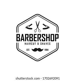 Barber shop vector vintage label, badge, or emblem on white background