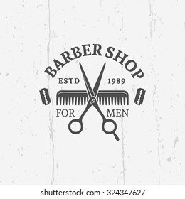 Barber shop vector vintage label, badge, or emblem on gray background with grunge texture