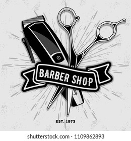 Barber shop vintage label, badge, or emblem with scissors and hair clipper on gray background. Haircuts and shaves. Vector illustration