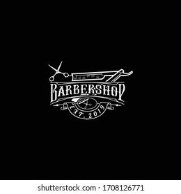 Diseño del logo de la barbería. Ilustración con letras antiguas en fondo oscuro. Todos los objetos, el texto están en los grupos separados.