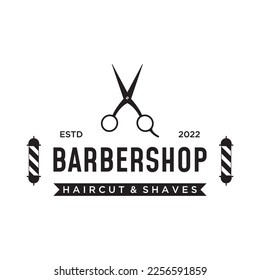 Barbershop logo in vintage style with the concept of scissors, razor and other tools.Logo for business, salon, label and barbershop.