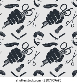 Barbershop seamless pattern with hipster face, hairdressing scissors, razor and hand holding hairdressing scissors and comb. Vector illustration
