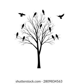 Bare tree silhouette with perched and flying black birds