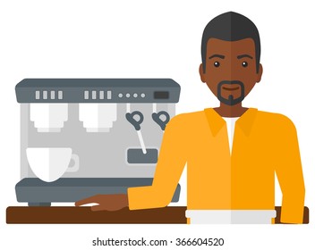 Barista standing near coffee maker.