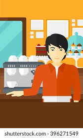 Barista standing near coffee maker.
