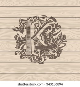 Baroque letters of the alphabet in upper case letters on wooden background. Letter K. Vector illustration
