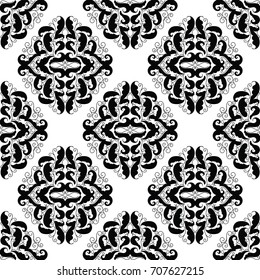 Baroque seamless pattern. Floral white vector damask background with black hand drawn scroll swirl flowers, leaves and antique ornaments in victorian style. Isolated endless  texture for wallpapers