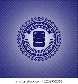 barrel icon inside badge with denim texture