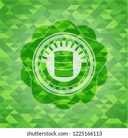 barrel icon inside green emblem with triangle mosaic background